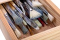 Wooden box with paint brushes Royalty Free Stock Photo