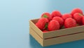 Wooden box with polygonal tomatoes on a blue background. The concept of selling vegetables, healthy food, seasonal