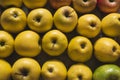 Wooden box with variety of apples.