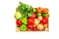 Wooden box with vegetables on a white background. Zucchini, carrots, cucumbers and greens. Flat lay. Fresh vegetables. Royalty Free Stock Photo