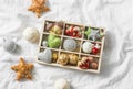 Wooden box of vintage christmas decorations on the light background, top view Royalty Free Stock Photo