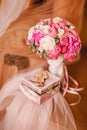 Wooden box for wedding rings with monogram of capital letters of the name in the heart on the background of the bride's