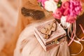 Wooden box for wedding rings with monogram of capital letters of the name in the heart on the background of the bride& x27;s