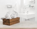 Wooden box with white spa towels on blurred bathroom background Royalty Free Stock Photo