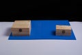 Wooden boxes on black background and blue mat