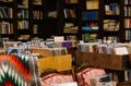 boxes with a collection of vinyl records against the background of shelves with books