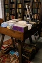 Wooden boxes with a collection of vinyl records against the background of shelves with books, libraries Royalty Free Stock Photo