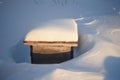 Wooden boxes for flowers under the snow in winter Royalty Free Stock Photo