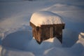 Wooden boxes for flowers under the snow in winter Royalty Free Stock Photo