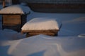 Wooden boxes for flowers under the snow in winter Royalty Free Stock Photo