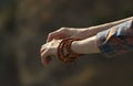 Wooden bracelet on the female hand.