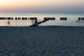 Wooden breakwater at sunset on the Baltic Sea Royalty Free Stock Photo