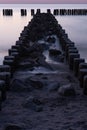 Wooden breakwater at sunset on the Baltic Sea Royalty Free Stock Photo