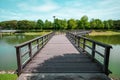 Wooden bridge across the lake at S2 City Park, Seremban 2, Malaysia