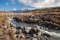 Wooden bridge across Mahuia River with Mount Ruapehu in distance, Tongariro National Park, New Zealand Royalty Free Stock Photo