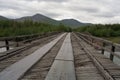 Wooden bridge across the river. Royalty Free Stock Photo