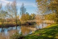 Wooden bridge in an autumnal landscape Royalty Free Stock Photo