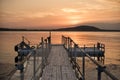 Wooden bridge on the beach and beautiful sunset near the sea Royalty Free Stock Photo