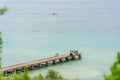 Wooden bridge within a beautiful scenery at Lake Garda in Sirmione, Italy. Royalty Free Stock Photo