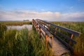 Wooden bridge for bicycles over river Royalty Free Stock Photo
