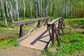 The wooden bridge in the birch forest Royalty Free Stock Photo