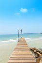 Wooden bridge, corridor to the sea on Beautiful crystal clear se Royalty Free Stock Photo