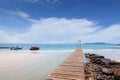 Wooden bridge to the sea on Beautiful crystal clear sea and tropical beach at tropical paradise island, Thailand Royalty Free Stock Photo