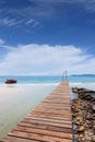 Wooden bridge to the sea on Beautiful crystal clear sea and tropical beach at tropical paradise island, Thailand Royalty Free Stock Photo