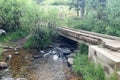 Wooden Bridge Crosses Gentle Stream Royalty Free Stock Photo