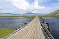 Wooden Bridge crossing Wide River in Northern Mongolia