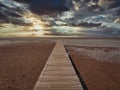 The wooden bridge that extends into the sea