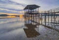 Wooden bridge in the fishing village at sunset in Setokok, Batam, Indonesia Royalty Free Stock Photo