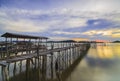 Wooden bridge in the fishing village at sunset in Setokok, Batam, Indonesia Royalty Free Stock Photo