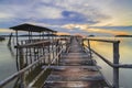 Wooden bridge in the fishing village at sunset in Setokok, Batam, Indonesia Royalty Free Stock Photo