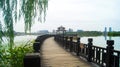 Wooden Bridge Flowing in Waterscape Park