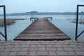 Wooden bridge on frozen lake Royalty Free Stock Photo