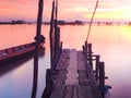 Wooden bridge and gondola moored