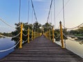 wooden bridge hang over the water in swam, Thailand