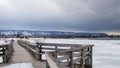 A wooden bridge in Lighthouse Point, Collingwood, crosses a portion of Georgian Bay Royalty Free Stock Photo