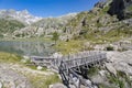 wooden bridge in the lower lake of cornisello Royalty Free Stock Photo