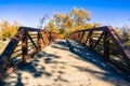 Wooden bridge with metal railing Royalty Free Stock Photo