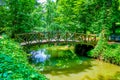 The wooden bridge among narrow river in Sofiyivka Park, Uman, Ukraine Royalty Free Stock Photo