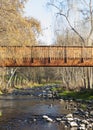 Wooden bridge over the Ambroz river in Abadia Caceres vertical gallery of trees