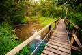 Wooden bridge over brook Royalty Free Stock Photo