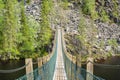 Wooden bridge over the canyon lake Julma-Olkky, Hossa National Park