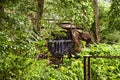 Wooden bridge over a creek as part of an old small weir near a historic watermill Royalty Free Stock Photo