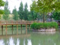 A wooden bridge over a lake Royalty Free Stock Photo