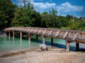 Wooden bridge over the Mangfall river, which rises from the Tegernsee Royalty Free Stock Photo