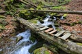 Wooden bridge over mountain brook