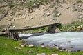 Wooden bridge over mountain river Royalty Free Stock Photo